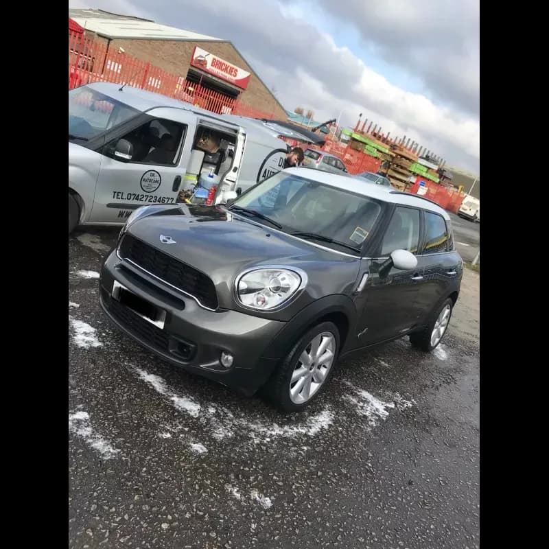 Dr. Autocare mobile valeting a Mini Countryman in Stockport — branded van visible in background